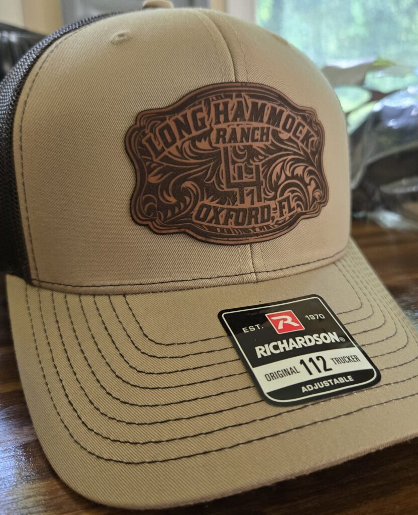 Beige Longchamps Ranch cap with a vintage logo patch.