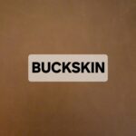 A brown surface with a label reading 'BUCKSKIN'.