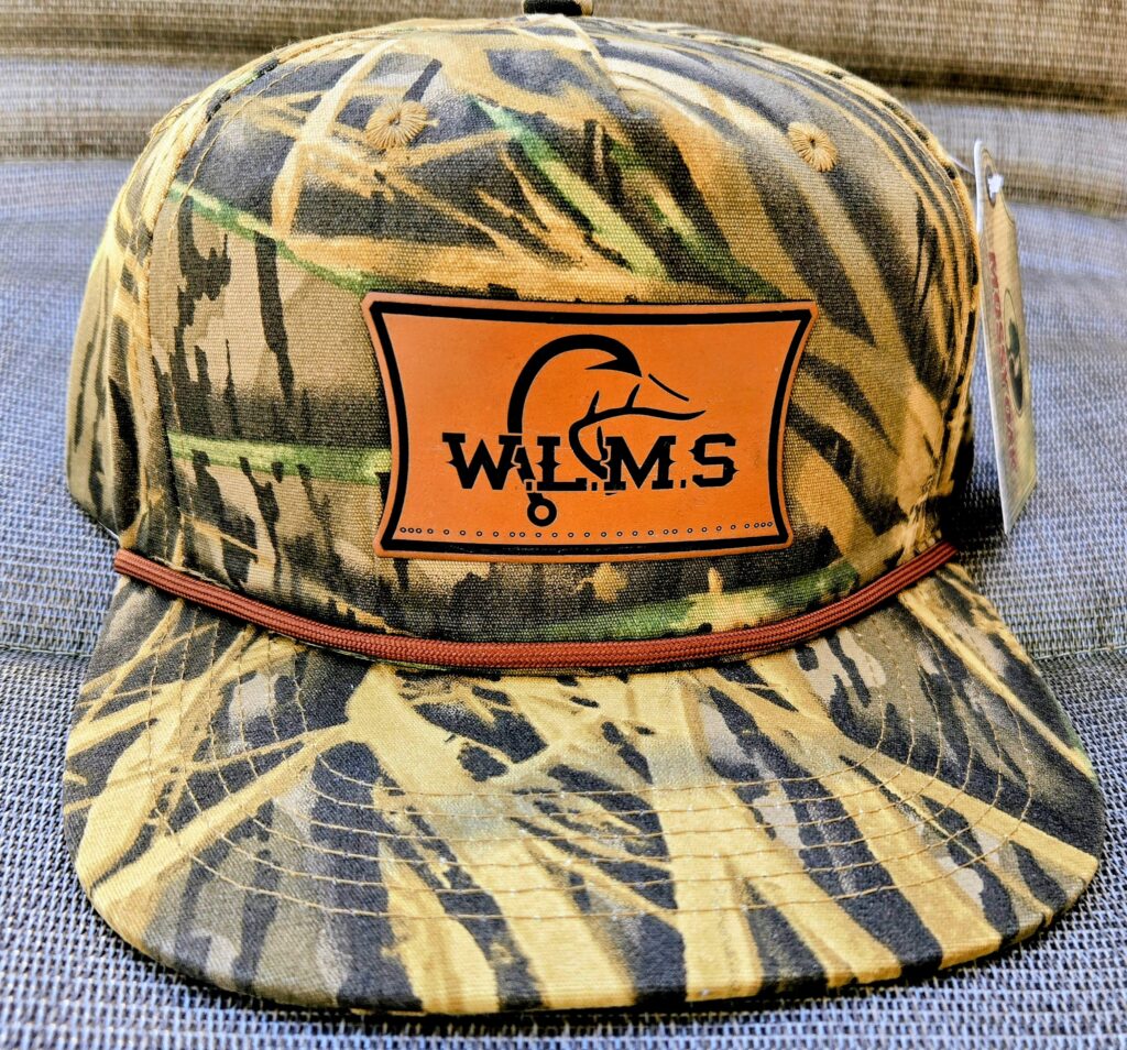 Camo-patterned W.L. Sims fishing hat with an orange logo patch.