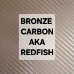 Sticker with text 'BRONZE CARBON AKA REDFISH' on a carbon fiber background.