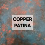 Abstract copper patina texture with blue and orange hues.